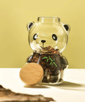 Airtight Glass Coffee Bean Jar With Fun Panda Lid showing coffee beans inside, bamboo lid beside on light background.