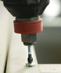 Bosch Phillips #2 impact screwdriver bit installed in a drill chuck with red collar
