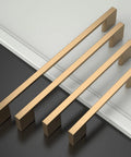 Set of 5 inch champagne bronze cabinet handles for cupboards, shown on a white and black surface, part of 10 Pack 5 Inch Champagne Bronze Cabinet Handles For Cupboards And Drawers Kitchen Cabinet Hardware Pulls Dresser Pulls Durable Metal Handles For Cabinets And Furniture Easy Install And Smooth Operation.