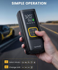 Hand holding Portable Car Tire Inflator Air Compressor Cordless 150 PSI With Rechargeable Battery Digital Pressure Gauge LED