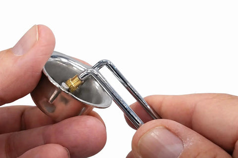 Close-up of Dual Flint Spark Striker Set 2 Pack For Welding Torches And Gas Tools in hand, showing steel igniter's tip and spark wheel