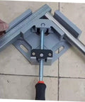 Heavy Duty Right Angle Clamp For Woodworking And Precision Welding With Badass Aluminum Build No Sweat Single Handle Design For Hella Tough 90 Degree Corners Every Time, gray clamp securing metal pieces at a right angle.