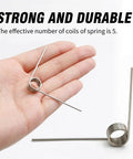 10 Pack Small Stainless Steel Torsion Springs 50mm Long 1.2mm Thick 11.4mm OD With 5 Turns And 120 Degree Rotation displayed on hand