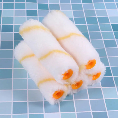 4 mini paint roller covers in white with yellow stripes, suitable for drywall, mud, and concrete surfaces in 20-Piece Mini Paint Roller Covers Kit.