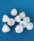 10 white nonstick bushings, part of 20 Pack Insulating Pen Bushings For Woodturning, 0.43 inch diameter on blue background