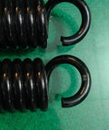 Pro Grade Heavy Duty Extension Springs Eleven Inch Hook To Hook By 1.94 Inch Outside Diameter close-up of black silicone steel springs.