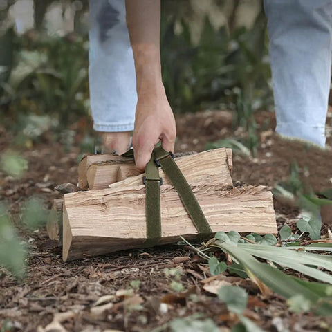 Strap It Down And Roll With These Tough Polyester Luggage Tie Straps used to carry firewood, showcasing durable green polyester material.