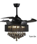 Total Game Changer 42 Inch Black Crystal Ceiling Fan With Adjustable Led Light And Wireless Remote 3 Speed Dead Simple Modern Fandelier Chandelier For Every Room angled view showcasing blades and crystal embellishments.