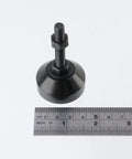 Set Of 4 Beefy Adjustable Furniture Leveling Feet With M8 Threads In Black Aluminum For Desks Tables And Cabinets next to ruler
