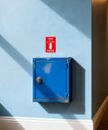10 Pack Fire Extinguisher Signs Vinyl Decals 6 By 4 Inch Self Adhesive installed above a blue cabinet, indoor setting