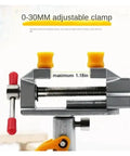 Super Durable Cast Iron Small Bench Vise With Suction Cup Flat Jaws And Precision Clamping Power For Hardwood Carving DIY Projects At Home Workshop Or Garage Table Use, 0-30mm adjustable clamp with red and yellow handles.