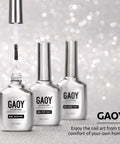 Three bottles of GAOY Two In One Nail Glue And Base Gel For Acrylic Tips 16ml UV Light Cure In Sixty Seconds displayed on glitter surface.
