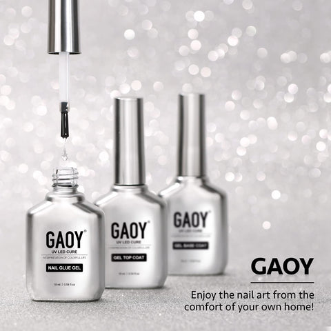 Three bottles of GAOY Two In One Nail Glue And Base Gel For Acrylic Tips 16ml UV Light Cure In Sixty Seconds displayed on glitter surface.