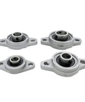 Thinking Process:. four vertical pillow block bearings with cast iron housing and chrome steel inserts for industrial use