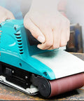 Person using 3X18 Inch Sanding Belt Set With 21 Belts Aluminum Oxide Paper For Sander on a woodworking project