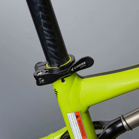 34.9mm Adjustable Bicycle Seatpost Clamp with Quick Release Aluminum Alloy Build on a bright green bike frame