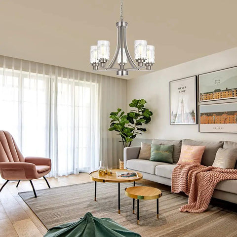 Five Light Modern Chandelier in Brushed Nickel Finish With Clear Hammered Glass Pendants hanging in living room setting.