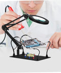 Technician using Five Piece Third Hand Soldering Tool Set with Gooseneck Arm and Rotating Clips for PCB repair.
