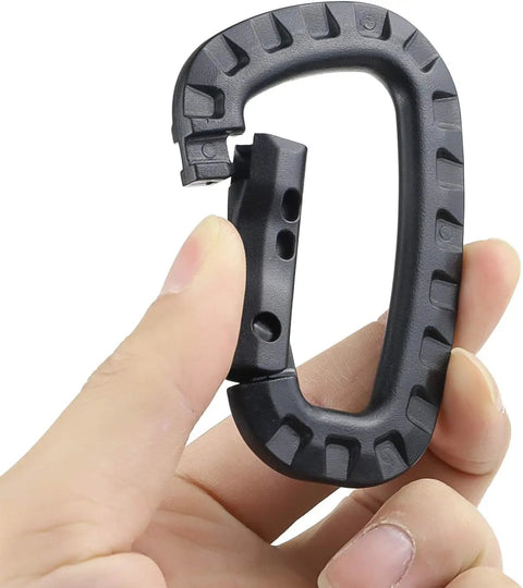 Person holding a Grab-And-Go Lightweight Polymer Carabiner Keychain, showing quick lock D ring clip, black, for camping and travel.