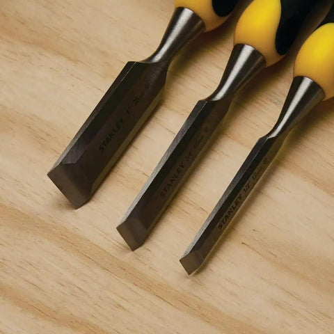 Close-up of Three Piece Chisel Set With Hardened Chrome Carbon Steel Blades, Short Series For Extra Control on wooden surface.