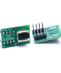 Two green DFN8 WSON8 MLF8 MLP8 QFN8 to DIP8 socket adapters for IC chips, showing pin layout and tape-free connection design.