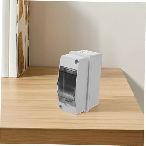 Weatherproof Electrical Junction Box With Transparent Cover on a wooden surface, IP65 rated for outdoor industrial control panels and power enclosures