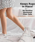 Person stepping on rug secured with Non Slip Rug Tape Peel And Stick Gripper For Hardwood Concrete And Carpeted Floors Keeps Rugs Secure