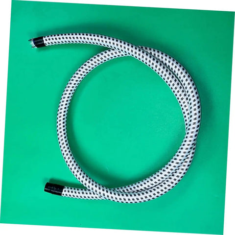 Garment Steamer Hose With High Temperature Resistant Steam Tube coiled on green surface.