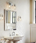 Bathroom interior with Braelyn 1 Light Wall Sconce With Clear Seeded Glass In Classic Pewter beside a mirror