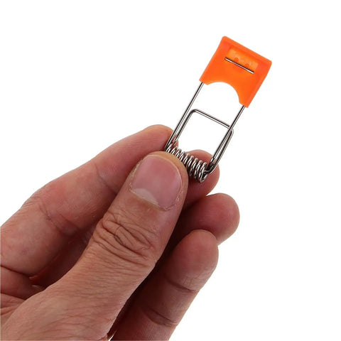 Lawsen Spring Clips Recessed Lighting 200pcs Spring Clips for Downlights LED Strip Lights Stainless Steel ceiling fixture held in hand.