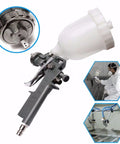 600ML Gravity Feed Paint Sprayer And Airless Pneumatic Spray Gun Alloy Airbrush with clear paint cup for precision applications.