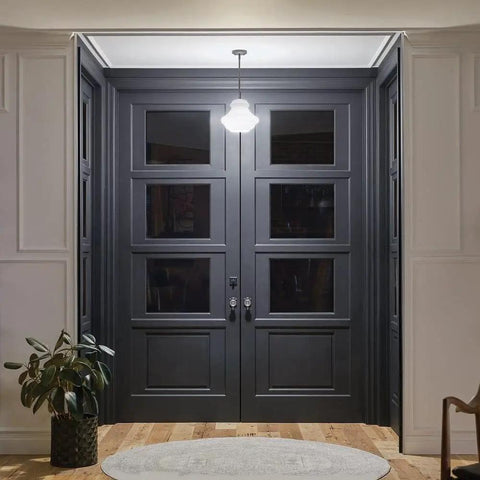 Everly Single Light Schoolhouse Pendant With Clear Glass Shade In A Chill Chrome Finish hanging above double doors