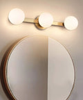 Slick Modern Brass Gold Three Light Vanity Fixture With Milky Glass Shades For Bathroom Over Mirror Wall Sconce Industrial Style Bath Lighting For Bedroom And Living Room Durable Construction Easy To Install Hardware Included Ideal For Powder Room.