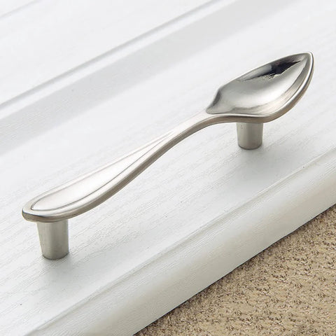 Spoon-shaped pull from 3 Piece Funny Knife Spoon Fork Shape Cabinet Pulls Set For Kitchen Cupboard And Drawer Handles With 3 Inch Center Hole Zinc Alloy