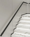 Knockout Modern Black Handrail Kit With Hella Non Slip Grip mounted on marble stairs, 0.8 inch grip diameter.