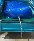 Massive Capacity Collapsible Water Bladder Tank For Gardens And Farms on truck bed, water pouring from valve, 1136L blue tank