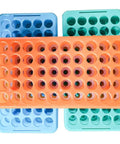 Pro Grade Lab Ready Plastic Test Tube Rack With Silicone Pad 50 Positions 18 mm Holes For 5 To 15 Ml Tubes Autoclavable Polypropylene Pack Of 3 With Alphanumeric Indexing For Lab Use, showing orange, green, and blue racks.
