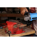 20V Lithium Ion Cordless Angle Grinder Built Like A Tank With An Adjustable Side Handle For Tough Cutting And Grinding Jobs Totally Wire Free So You Can Cruise Through Any Project Without Breaking A Sweat Or Dealing With Snags, in use creating sparks.
