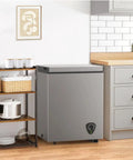 Solid 3.5 Cu Ft Chest Freezer With Easy Dial And Slide Basket Energy Efficient Top Load Deep Freeze In Gray in a kitchen setting.