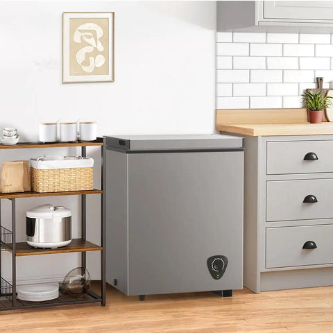 Solid 3.5 Cu Ft Chest Freezer With Easy Dial And Slide Basket Energy Efficient Top Load Deep Freeze In Gray in a kitchen setting.