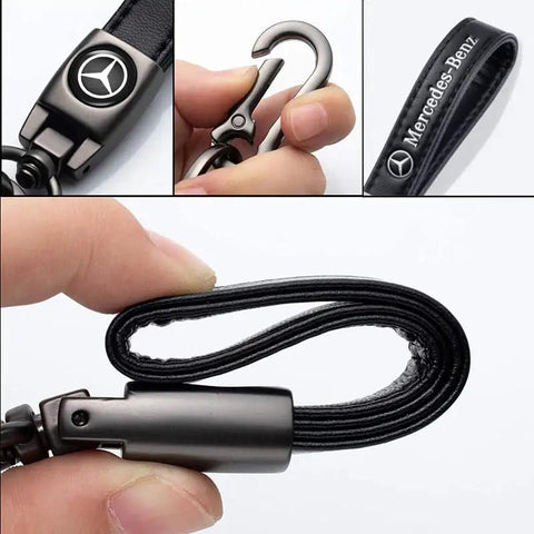Close-up of Mercedes Benz Tire Valve Caps And Leather Keychain Set showing black leather strap and metallic clasp.