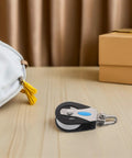 Stainless Steel Nylon Pulley Wheel Swivel Block 209kg Bearing Single Pulley on wooden table near gift box and bag