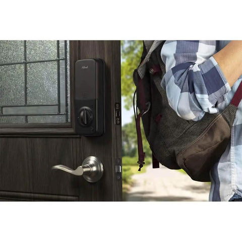Hardcore Touchscreen Smart Door Lock With Keypad And Bluetooth installed on wooden door, person standing nearby