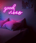 Bedroom with pink glow from Good Vibes Pink Neon Sign With Dimmable USB Power Ultra Bright LED Wall Light For Bedroom