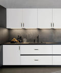 Modern kitchen with white cabinets featuring 10 Pack Black And Gold Knurled 5 Inch 128mm Hole Center Cabinet Handles installed
