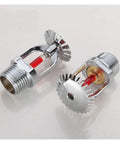 Rock Solid Fire Sprinkler Kit With Blazing Fast 68C Trigger Activation And Dead Simple Dn15 Hookups For Regular Folks Craving Bulletproof Home And Office Protection Gear - close-up of two copper sprinkler heads with red triggers.