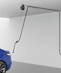 Drop Dead Easy Ceiling Mount EV Charger Cable Retractor With Smooth Auto Glide 11.5 Ft Spool installed above blue car in garage.