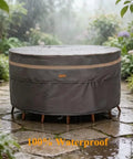 Heavy Duty Round Patio Table And Chair Cover 84 Inch Diameter 28 Inch High Waterproof UV Resistant Dark Grey Fits 84 Inch Tables Or 47 Inch Tables With Chairs Outdoor Weatherproof Protection shown covering furniture in garden