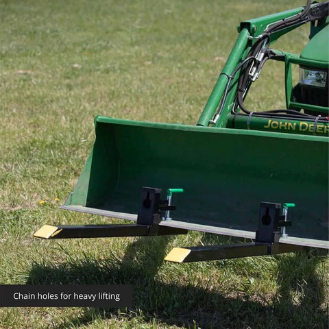 Light Duty Clamp On Pallet Forks, 43 Inch Overall Length, 30 Inch By 3 Inch Fork Blades mounted on green loader bucket
