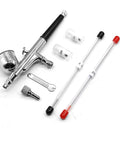 Straight Shooting Dual Action Airbrush Spray Gun With Replacement Needles And Nozzles Portable Air Compressor Kit showing gun and spare nozzles.